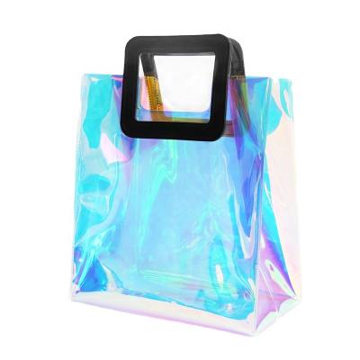 China Recyclable Custom PVC Printing and Logo Shiny Transparent Lady Bag Travel Makeup Cosmetic Holographic Pouch with Ribbon/Leather Handle for sale