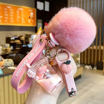 China Acrylic Luxury PVC milk bottle Keychains boba llaveros floating computer nail clippers pom pom liquid key chain for sale