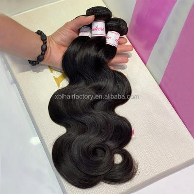 China Non-chemical 100% Indian remy human hair body wave 12a virgin raw natural black hair extensions unprocessed for black women for sale