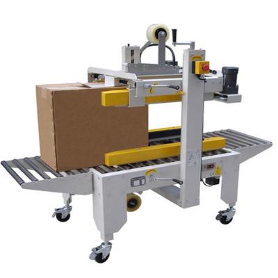 China Automatic CLOTHING Box Carton Sealer Machine Carton Box Tape Sealing Machine for sale