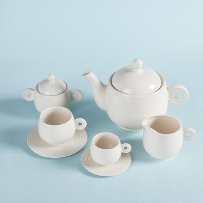 China Cute Tea Sets Teapot And Cup Set With Customized Box White Ceramic Teapot Logo Packing Paper for sale