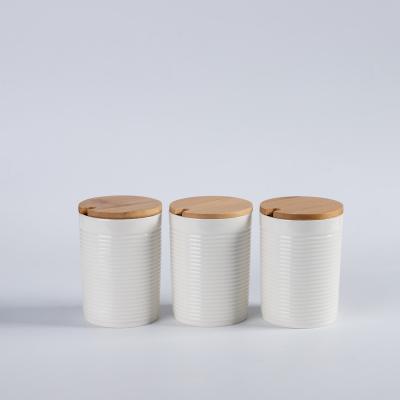 China New Design Amazon Ceramic Storage Jar Hot Modern Custom Bamboo Lid Jar With Cover Wood Canister Sets For Kitchen for sale