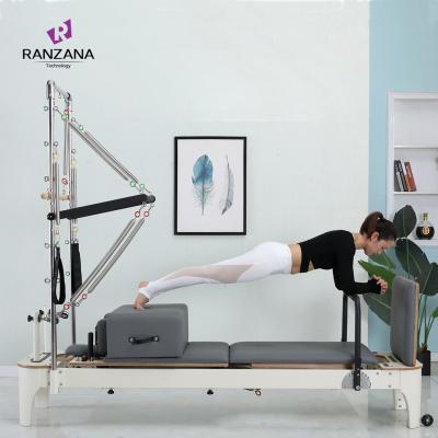 China Durable Multifunctional Sliding Bed Semi-Elevated Pilates Equipment White Core Bed Custom Pilates Reformer Tower for sale