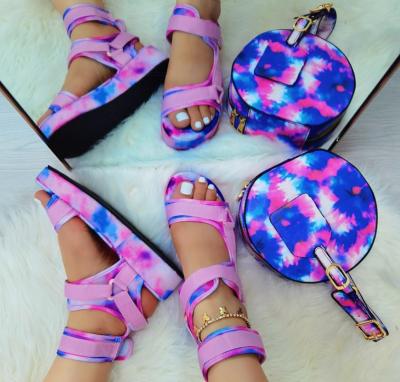 China Fashion PDEP Trend Colors Women Shoes Tied Tied Bright Slippers Latest Flat Matching Sandals And Purse For Ladies for sale