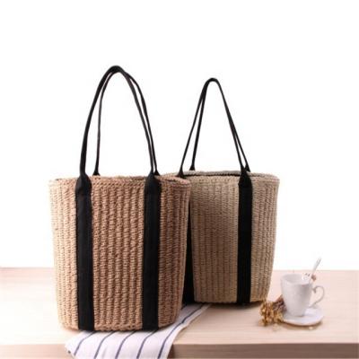 China New Waterproof Simple Straw Woven Handbag Draw String Single Bag Large Capacity One Shoulder Handwoven Handbag For Women for sale