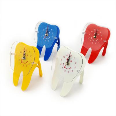 China Colorful cartoon tooth clock en venta