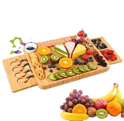 China 2021 Multifunctional Sustainable Hot Selling Amazon Natural Bamboo Cheese Board Set With Drawer for sale