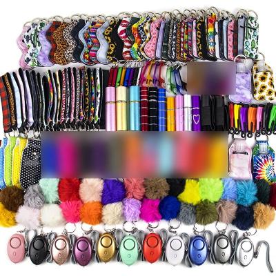 China USA metal shipping 10 pieces cheap grade portable key chain set colorful plastic key chain women pompom balls for sale