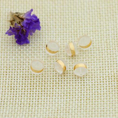 China Fashionable Silicone Earring Transparent Back With Round Gold Ring Earring Back for sale