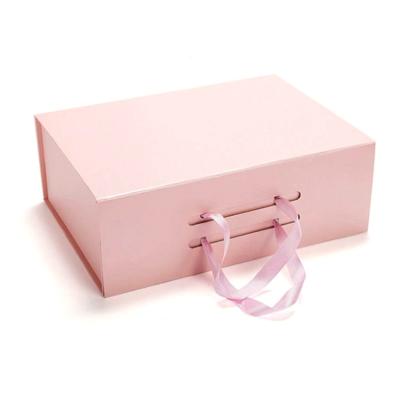 China Recyclable Custom Luxury Book Shaped Ribbon Closure Package Paper Cardboard Packaging Boxes Flat Folding Pink Magnetic Gift Box For Wedding for sale