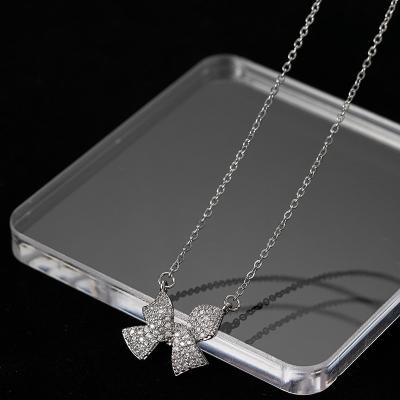 China FASHIONABLE Luxury Diamond Silver Plated Stainless Steel Full CZ Zircon Brilliant Bow Pendant Necklace Bow Pendant Necklace for sale