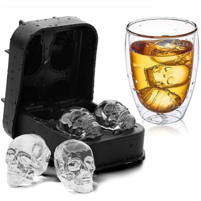 China Stocked Wholesale 4 Holes 3D Whiskey Ice Cube Mold Trays Bar Part 4 Cavity Crossbones Shape Ice Mold Silicone Ice Cube Tray for sale