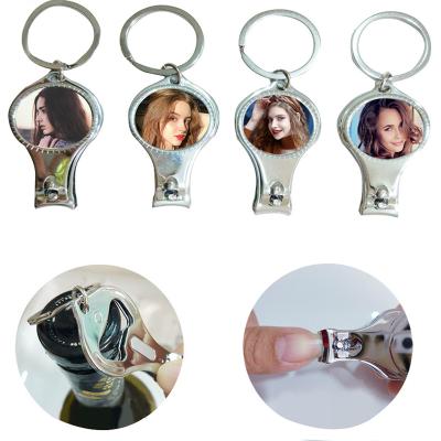 China Multifunctional Finger Sublimation Blank Hand Toe Opener Keyring Nail Scissors Foldable Nail Cutters for sale