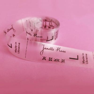 China Other Custom Matte Size Strips Transparent Labels Rivet Fabric TPU Washing Care Labels for sale