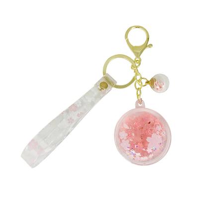 China Hot Cherry Blossoms Quicksand Oil Key Chain Woman Bag Car Oil Key Chain Creative Liquid Rubber Keychain Pendant Liquid Accessories for sale