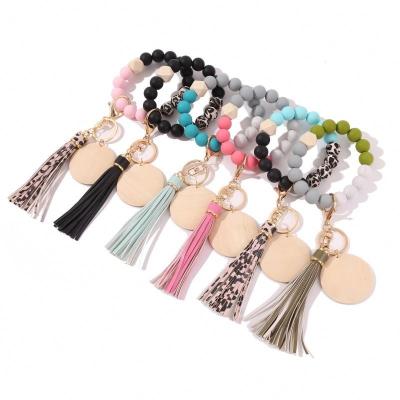 China 2022 Custom Women's Keychains Monogram Disc Key Chain 24CM Key Ring Holder Silicone Bead Tassel Wooden Empty Bracelet Bangle for sale