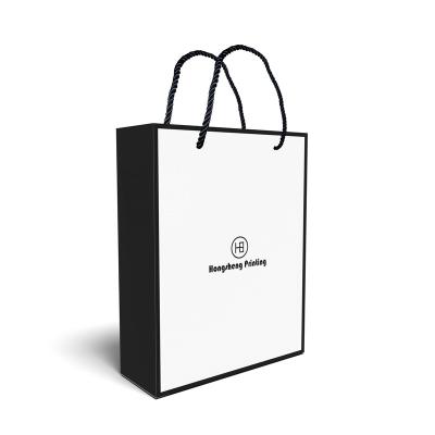 China Recyclable Eco - Friendly Kraft Materials Fancy Paper Shopping Bag With Twist Handle for sale