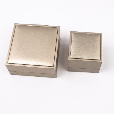 China Luxury Elegant Gold Jewelry Package Brown Storage Case Ring Gift Hand Chain Bracelet Pendant Box for sale