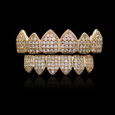 China Hiphop Iced Out Grillz Gold And Jewelry Silver Copper Micro Pave Bling Bling 3A CZ Hip Hop Teeth Grillz Set for sale