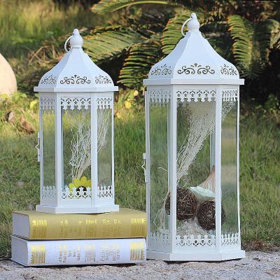 China Retro Floor Home Candlestick Iron Decoration Windproof Storm Candle Outdoor Wedding Lantern for sale