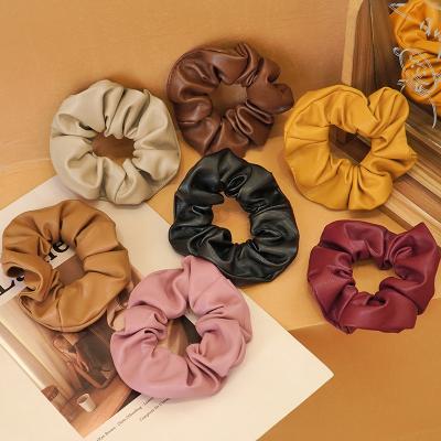 China Winter Knitted Hair Bands 4.35 Inch Pu Hair Scrunchies Ponytail Holders Girls Winter Elastic Leather Hair Ties for sale