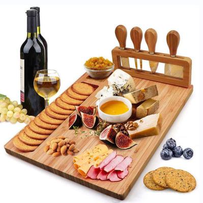 China Hot Selling Stocked Cheese Bamboo Cutting Board with Tray Natural Kitchen Charcuterie Set Knife Chopper for sale