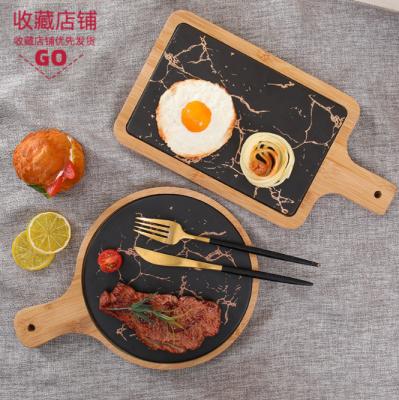 China Stocked Serving Trays and Gold Food Black Marble Bamboo Stand Trays Wooden Dishes for Steak Fruit Bread Pizza for sale