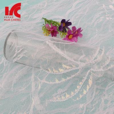 China Sustainable Unique White Tulle Fabric Wedding Lace Mosquito Net Decorate Lace Trim for sale