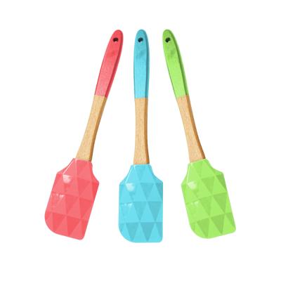 China Food Grade Sustainable Cooking Tools Silicone Multicolor Heat Resistant Spatula With Non-Slip Wooden Handle for sale