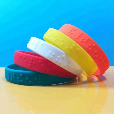 China Free Sample Casual/Sporting Fitness Embossed Braille Silicone Wristbands Custom Logo Embossed Color Printing Silicon Wristbands for sale