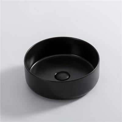 China Easy Clean European Style Ceramic Wash Basin Round Over Counter Basin Matte Black Color Bathroom Sink for sale