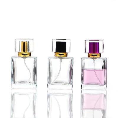 China Wholesale Empty Design 30ml Cosmetic Glass Refillable Perfume Bottles With Lid for sale