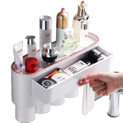 China Cheap Home Plastic Bathroom Accessory Set Automatic Toothpaste Squeezer Toothpaste Dispenser Holder With Toothbrush Holder for sale