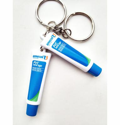 China Soft plastic artificial shape toothpaste promotion gift white 3D PVC key chain advertising promotional gifts key chain for sale