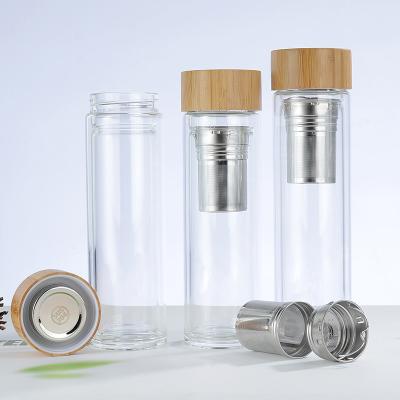 China Sustainable Laser Engraved 500ml Tea Infuser Double Wall Bottles Glass With Bamboo Lid for sale