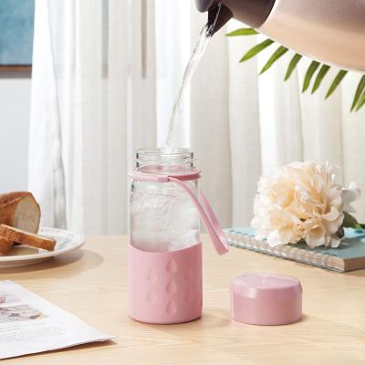 China Custom Viable Relea Print Cute Pink Glass Water Bottles Borosilicate Tea Infuser Bottle With Sleeve for sale