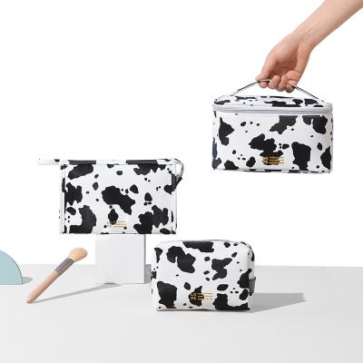 China Durable Cow Print Animal Pattern Waterproof Toiletry Bag High Capacity Cosmetic Bag Travel Make Up Storage Bag With Handle for sale