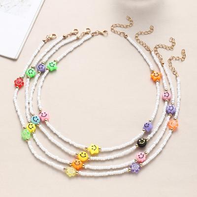 China Wholesale Trendy Fashion Women Jewelry Hand Threading Rice Pearl Face Necklace Clavicle Chain Necklace Smile Accessories for sale