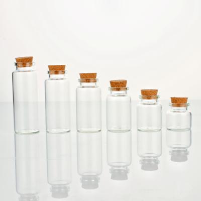 China Gift & High quality mini craft borosilicate glass bottle 10ml 15ml 20ml 25ml 30ml 40ml with a cork top for sale