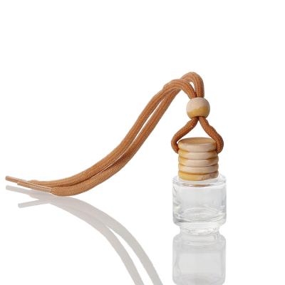 China Wholesale 6ml Car Perfume Cosmetic Car Air Freshener Hanging Perfume Bottle With Wooden Lid for sale