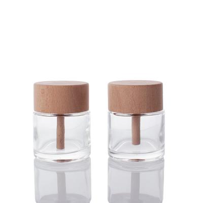 China Aromatherapy Cosmetic Custom Glass Bottle Round Tubular Glass Diffuser Bottle With Wooden Lid for sale