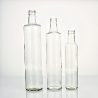 China Food Glass Bottle 500ml Round Transparent Olive Oil Bottle With Lid for sale