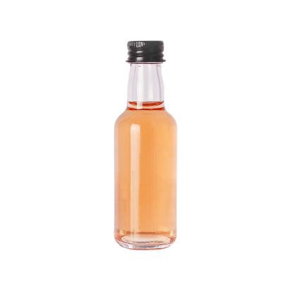 China High Quality Little Round 50ml Liquor Vodka Whiskey Whiskey Transparent Empty Glass Beverage Bottle Round 50ml for sale