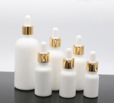 China Sorts Capacity Cosmetic Luxury Refillable Essential Oil White Glass Bottle for sale