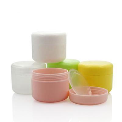 China Cosmetic Empty Plastic Cream Jars Sample Jars Cosmetic Container With Colored Lids for sale