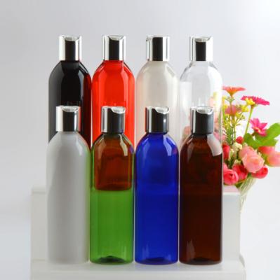 China Cosmetic Professional Plastic PET Plastic Bottles With Gold Disc Cap Lid for sale