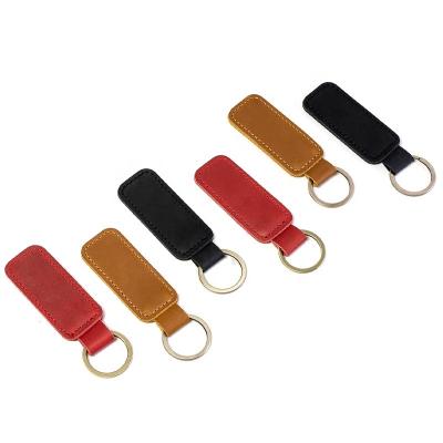 China Leather key chain pendant tan leather pendant simple personality promotion key chain locomotive key chain accessories customized for sale