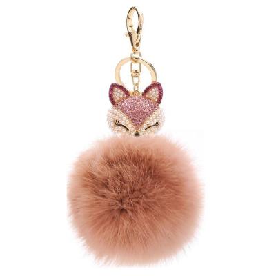 China Eco-friendly Fur Ball Fox Lucky Charm Key Chain With Rhinestone Pompom Pearl And Key Chain Gift AD1170 for sale