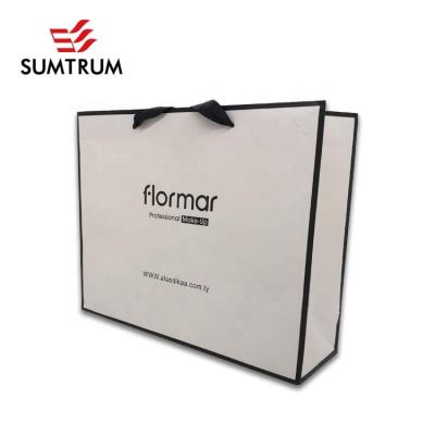 China Custom Recyclable Logo Printed Gift Shopping White Paper Bag With Black Border for sale