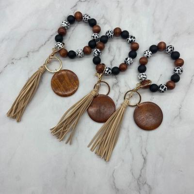 China Fashiontable Personalized Wooden Tassel Bracelet Monogram Leopard Beads Key Chain for sale